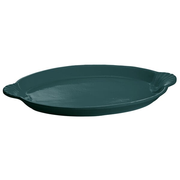 A hunter green cast aluminum oval shell platter with a handle.