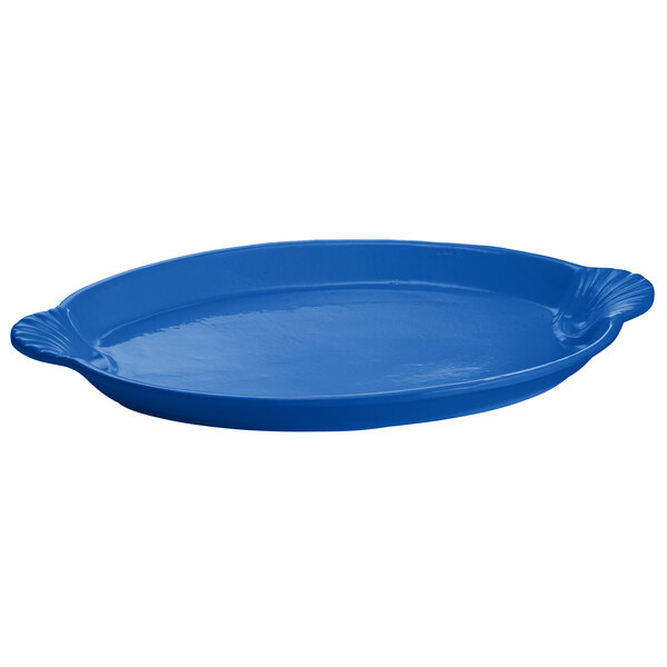 A cobalt blue oval cast aluminum serving platter.