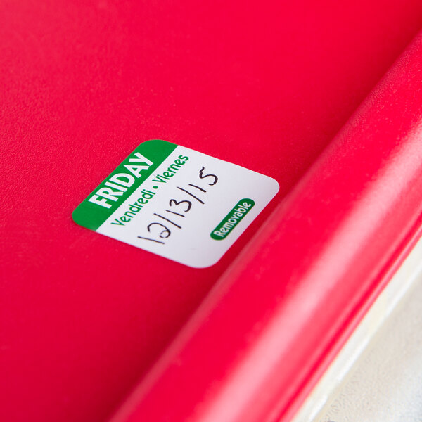 A red plastic container with a white National Checking Company Friday food label sticker on it.