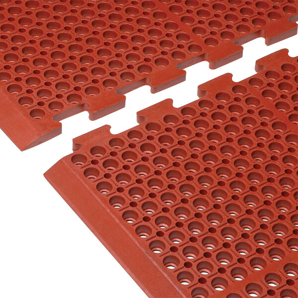 Two red Cactus Mat Duralok anti-fatigue puzzle mats with beveled edges.
