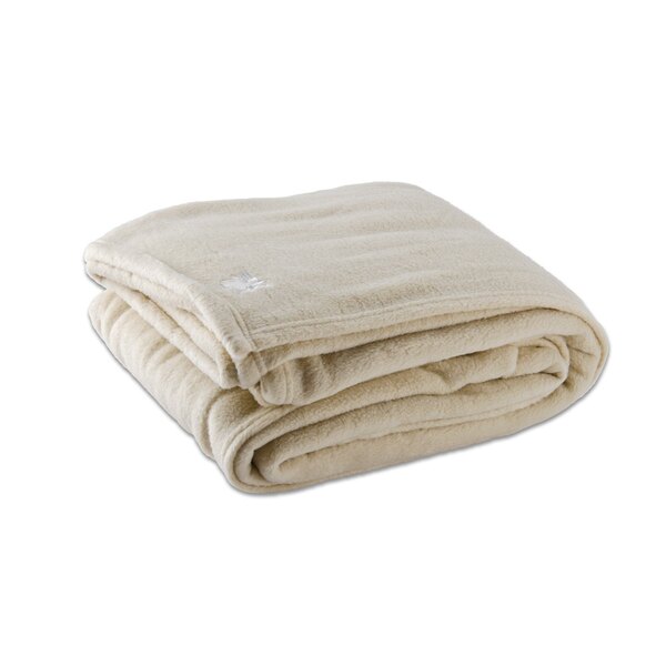 A stack of folded vanilla Oxford queen size hotel blankets.
