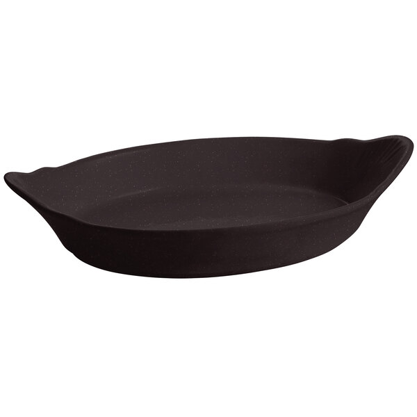 A black oval shaped pan with a white speckled finish.