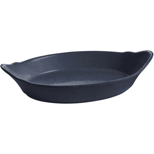 A black oval Tablecraft au gratin dish with blue speckles and a handle.