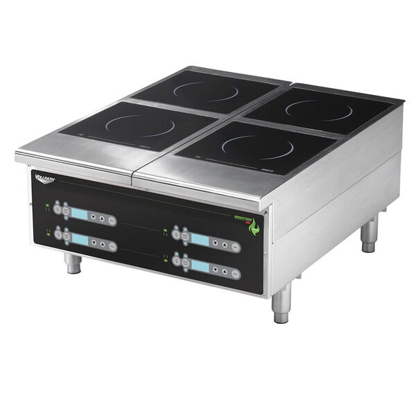 A black Vollrath countertop induction hot plate with digital controls on a counter.