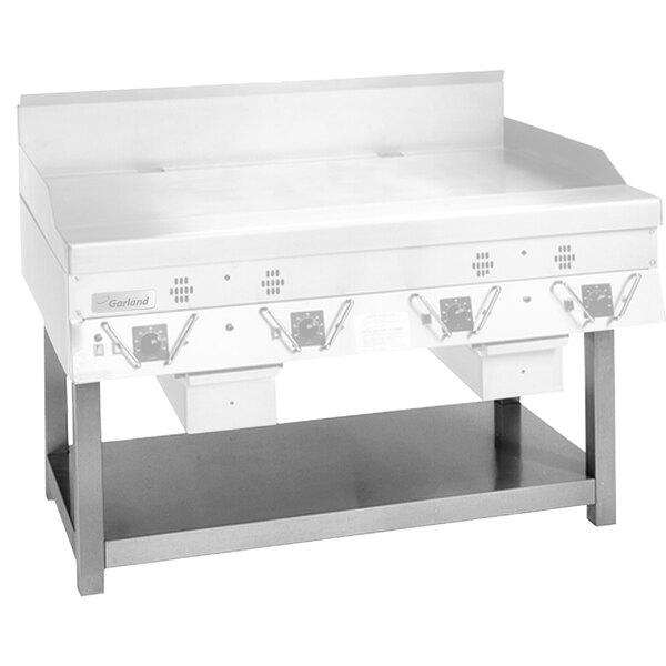 A stainless steel equipment stand with an undershelf for griddles.