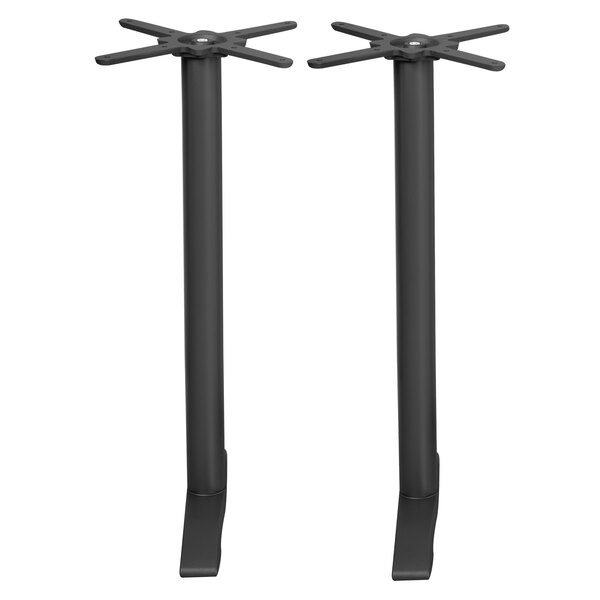 A pair of black metal table bases.