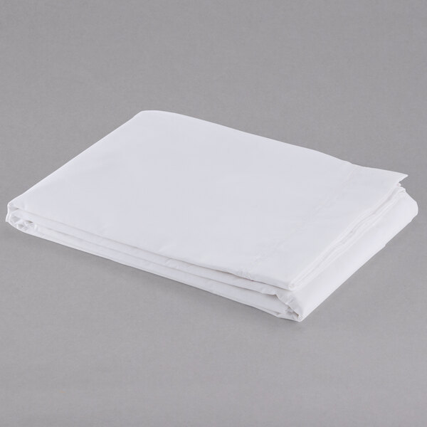 A folded white Oxford T300 Super Deluxe XL King Size flat sheet on a gray surface.