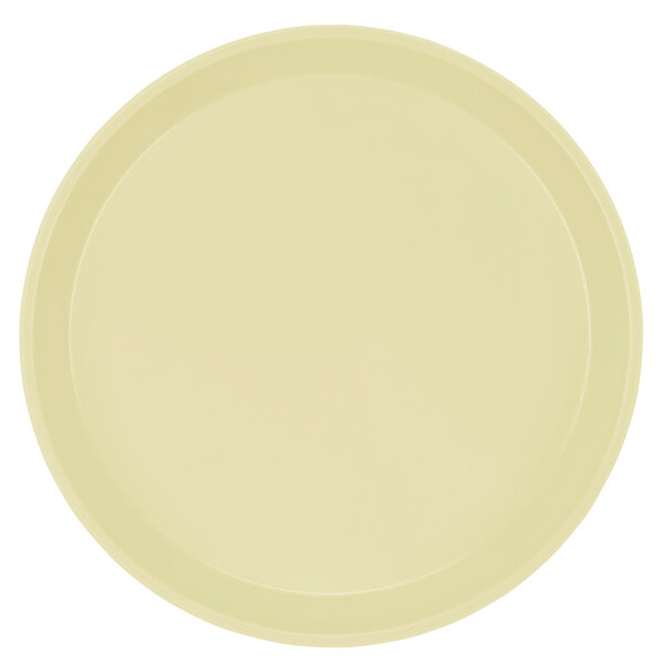 A white round Cambro cafeteria tray with a yellow rim.