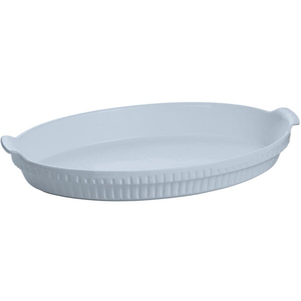 A white oval Tablecraft casserole dish with a handle.
