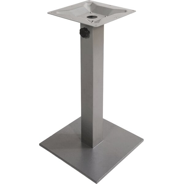 A metal square table base with a hole in it.