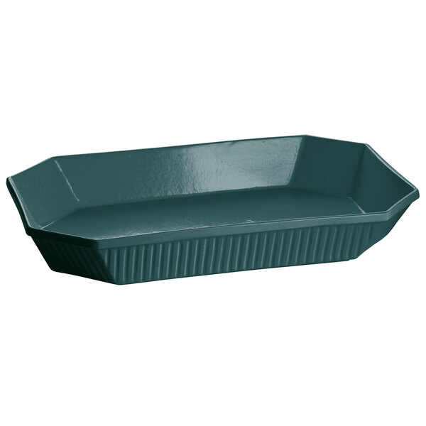 A Tablecraft hunter green cast aluminum octagon casserole dish with a handle on a green tray.