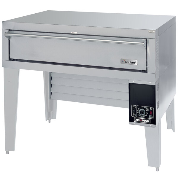 A large rectangular stainless steel Garland pizza oven with a bottom-mounted drawer.