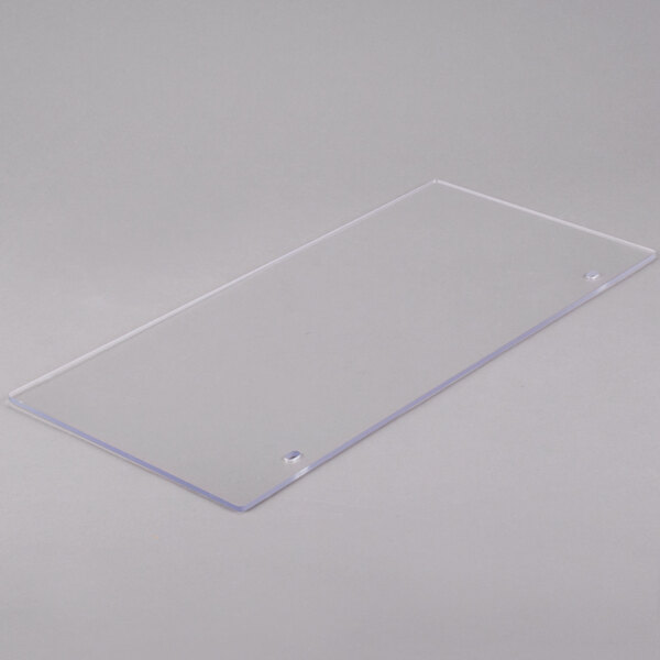 A clear rectangular plastic panel with a small hole in it.