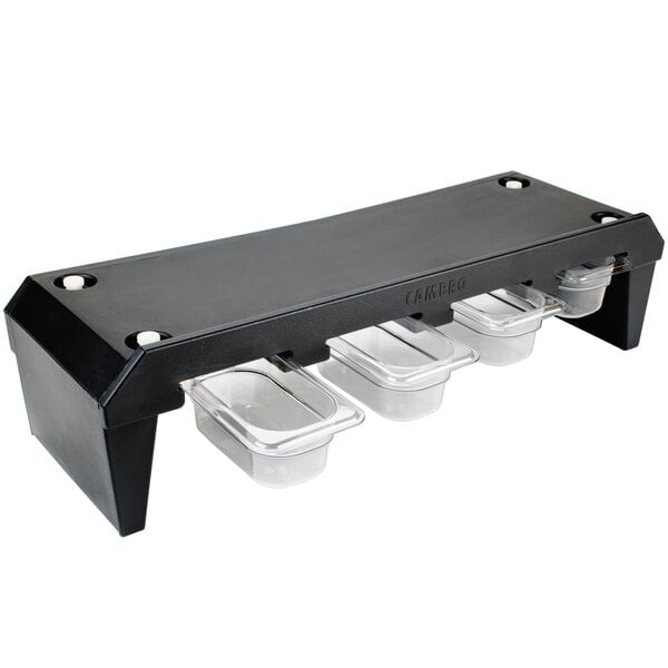 A black plastic tray with clear plastic containers on a counter.