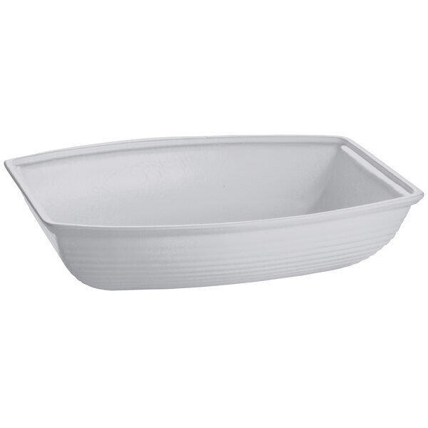 A natural cast aluminum oblong salad bowl with rounded edges.