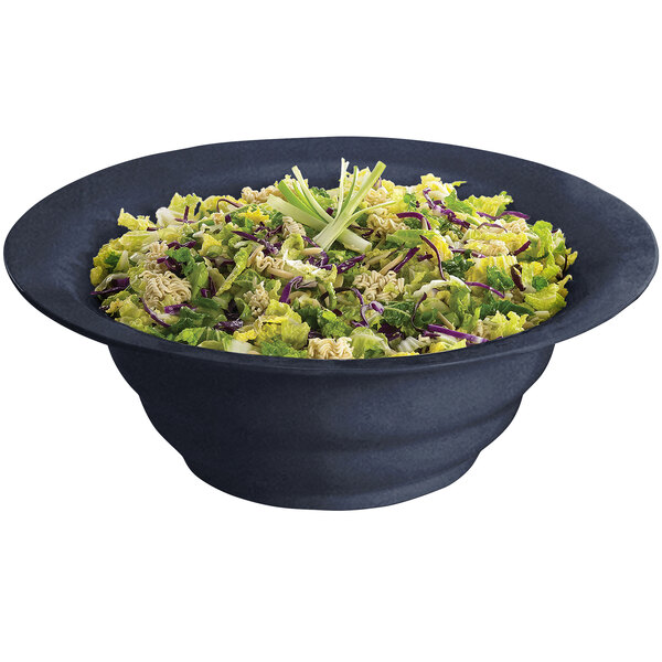 A Tablecraft midnight blue speckle salad bowl filled with lettuce and celery.
