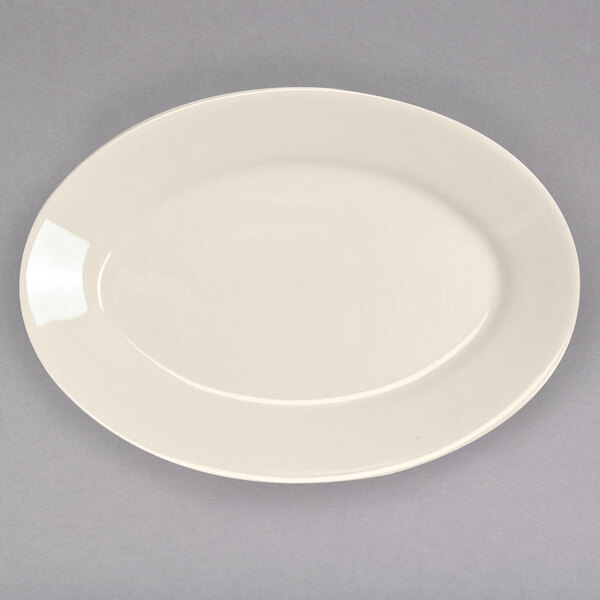 An ivory oval platter with a rolled edge.