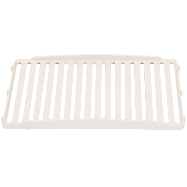 A white plastic Grindmaster Cecilware beverage dispenser drip tray grid with holes.