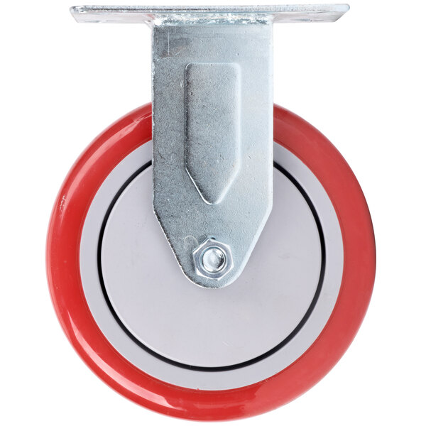 A metal plate with a red Winholt castor wheel.