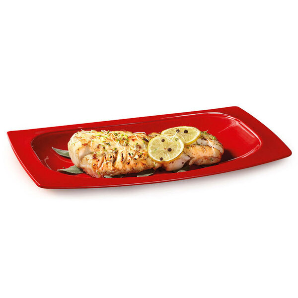A red GET Red Sensation oval platter with two pieces of fish on it.