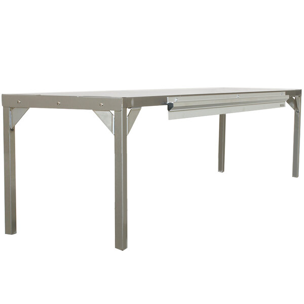 A Delfield stainless steel overshelf on a metal table.