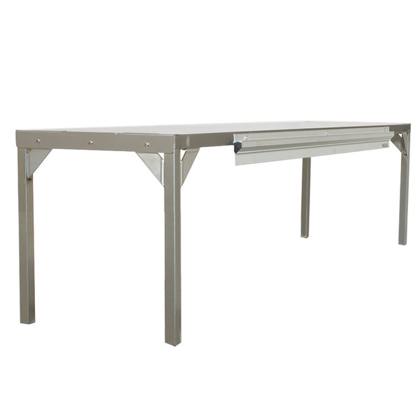 A Delfield stainless steel single overshelf on a metal table.