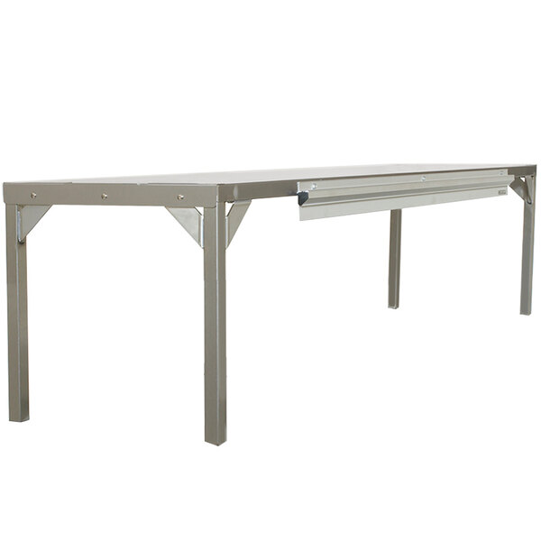 A stainless steel Delfield single overshelf on a long table.