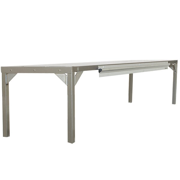 A Delfield stainless steel single overshelf on a table.