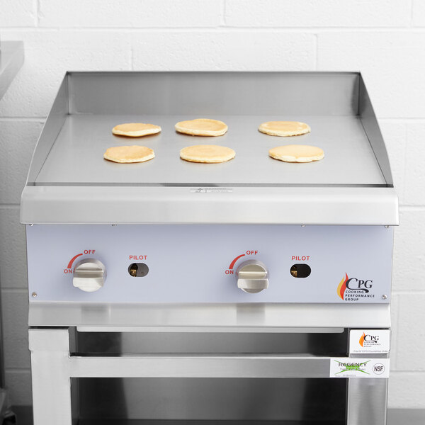 A Cooking Performance Group gas countertop griddle in a commercial kitchen.