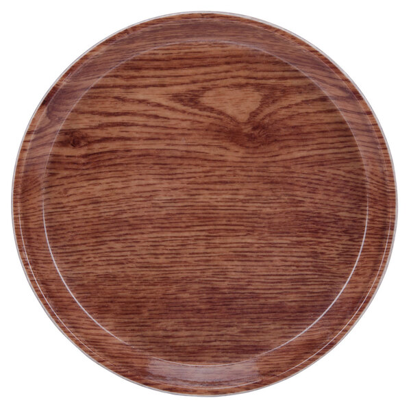 A round wooden plate with a white rim.