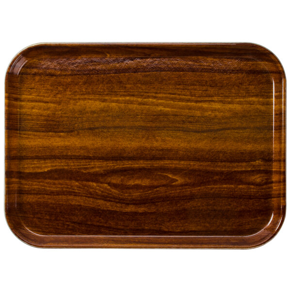 A rectangular wooden tray with a dark wood finish.