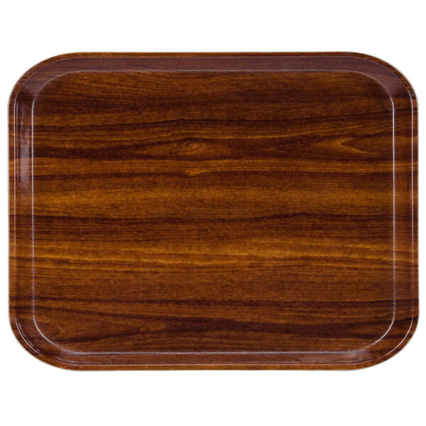 A rectangular Cambro fiberglass tray with a dark wood finish.