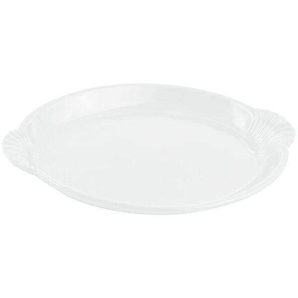 A white Bon Chef cast aluminum platter with a shell and fish design.