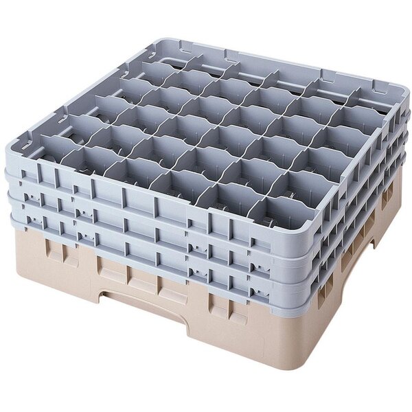 A beige plastic Cambro glass rack with 36 compartments.