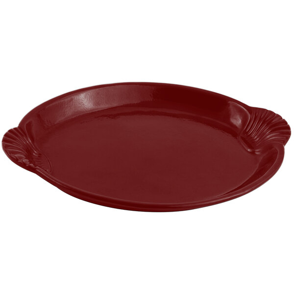 A red Bon Chef cast aluminum shell and fish platter with a scalloped edge.