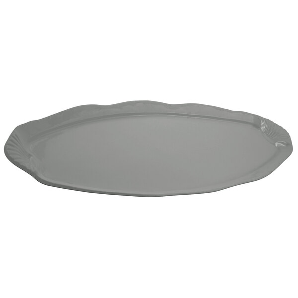 A platinum gray rectangular platter with a scalloped edge and shell and fish design.