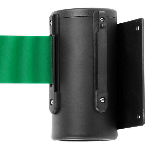 A black rectangular wall mount with a green retractable belt inside.