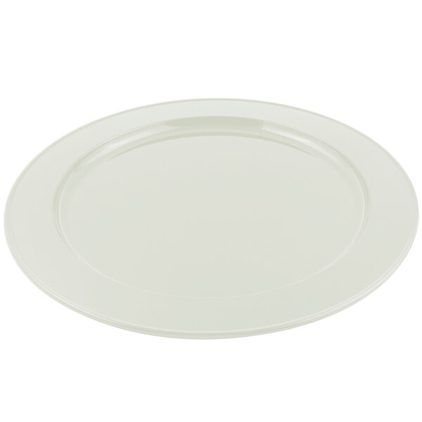 A round ivory sandstone finish metal platter with a white rim.