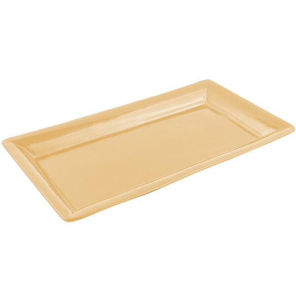 A rectangular tan Bon Chef cast aluminum food / display pan with a sandstone finish.