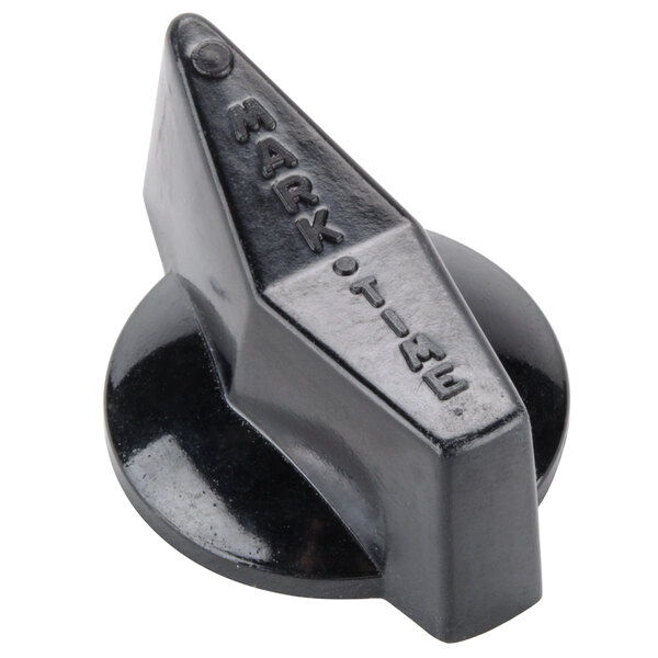 A close-up of a black plastic Nemco timer knob with a small hole in it.