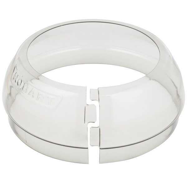 A clear plastic rectangular ring with two holes in it.