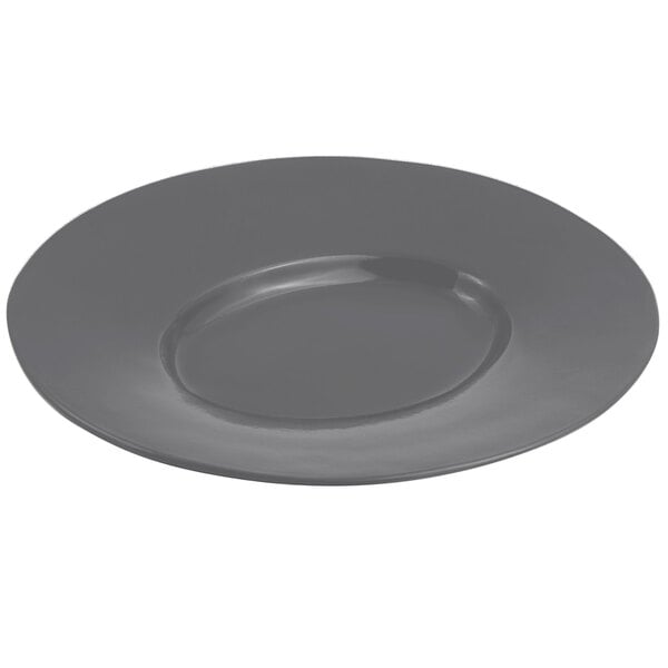 A close-up of a Bon Chef smoke gray cast aluminum wide rim platter with a round rim.