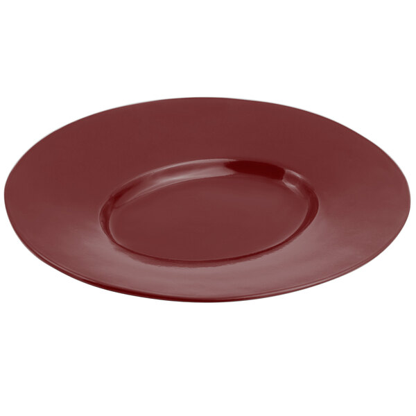 A red Bon Chef cast aluminum platter with a wide round rim.