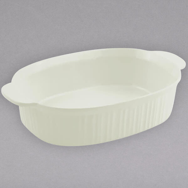 A white oval Bon Chef casserole dish with handles.