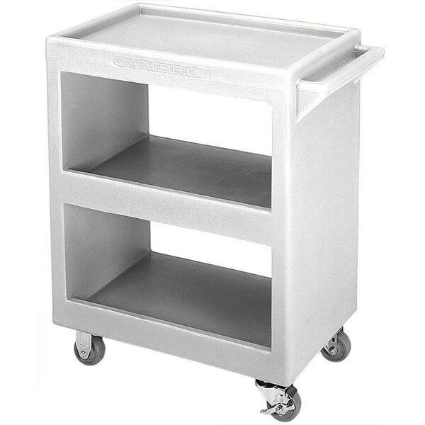 A granite gray Cambro service cart with three shelves on wheels.