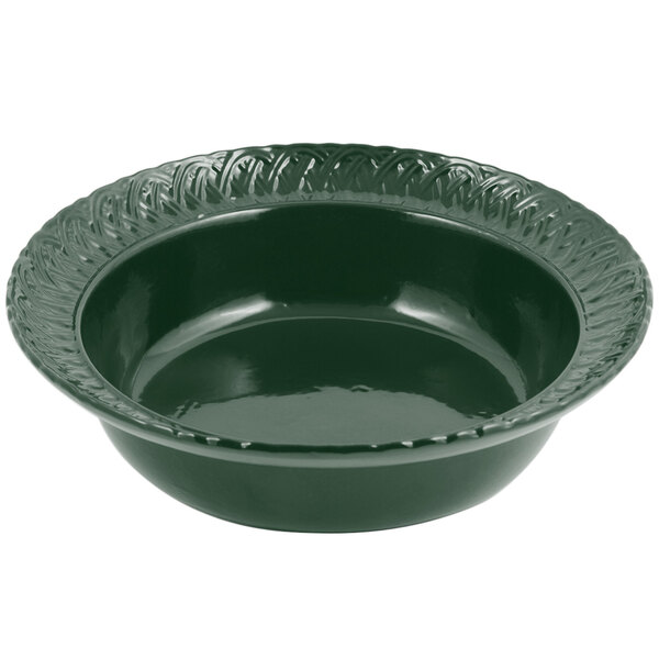 A close up of a Bon Chef Hunter Green cast aluminum bowl with a decorative edge.