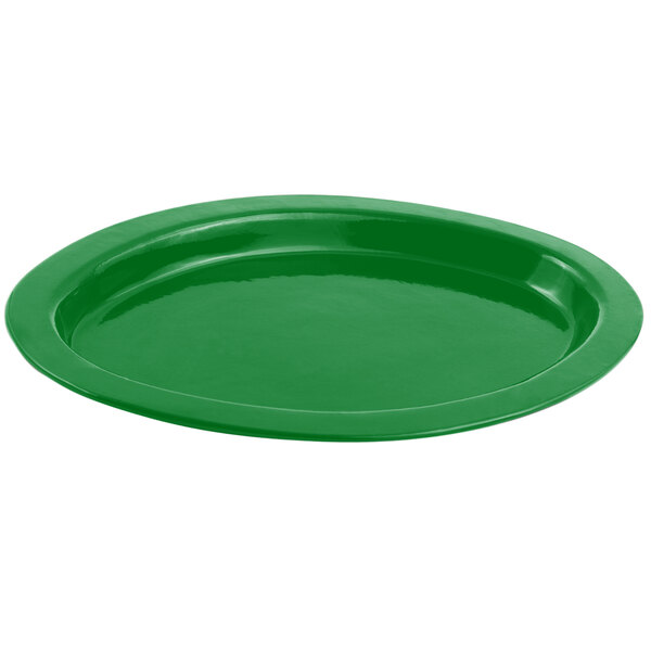 A green Bon Chef oval casserole dish with a curved edge.