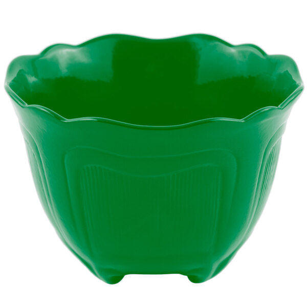 A green Bon Chef garnish bowl with a scalloped edge.