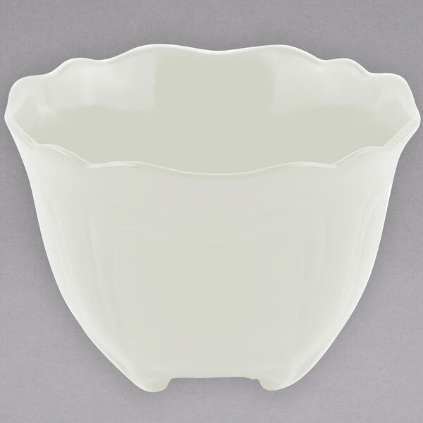 A white bowl with wavy edges.