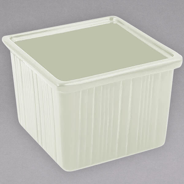 A white square Bon Chef space saver bowl with a lid.